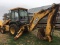 JD 310SE Backhoe, Ext. Hoe w/pallet forks, SN #T0310SE851850