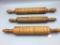 Lot of three antique tiger maple rolling pins