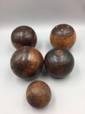 Lot of five antique wooden bocce and croquet balls