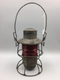 The Adams Westlake lantern with red glass globe