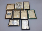 A lot of nine framed double sided advertisement