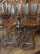 FOUR WOODEN SWIVEL BAR STOOLS WITH METAL FOOT RING,