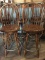 FOUR WOODEN SWIVEL BAR STOOLS WITH METAL FOOT RING,