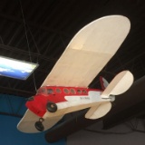 RED & WHITE AIRPLANE HANGING FROM CEILING