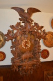 ORNATELY CARVED GERMAN CUCKOO CLOCK WITH BOAR BELOW