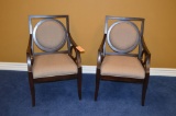 PAIR OF DARK BROWN WOOD ARM CHAIRS WITH TAN