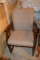 TAN UPHOLSTERED CHAIR WITH WOOD FRAME