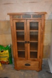 TWO DOOR WOODGRAIN CABINET WITH LOWER STORAGE