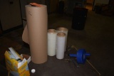 BROWN KRAFT PAPER AND SMALL ROLLS OF SHRINK WRAP