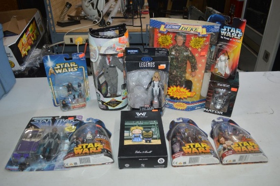 NEW IN PACKAGE TOYS AND FIGURINES IN LARGE GRAY BIN
