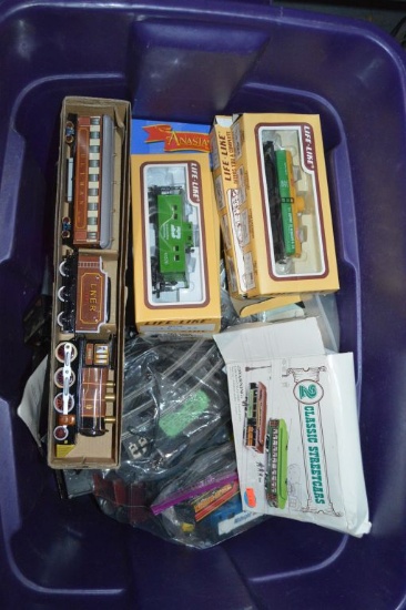 LOT OF TRAIN CAR THEMED TOYS IN PURPLE BIN