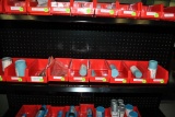SMALL RED BINS WITH ASSORTED TOOLING ON SECOND SHELF FROM TOP