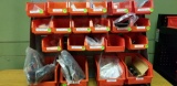 BENCH TOP RACK WITH RED BINS OF ASSORTED TOOL HOLDERS,