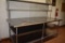 STAINLESS STEEL TABLE WITH UPPER AND LOWER SHELVES,