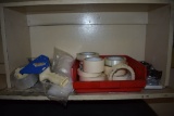 RED BIN WITH MASKING TAPE, BAGS AND TAPE GUNS ON
