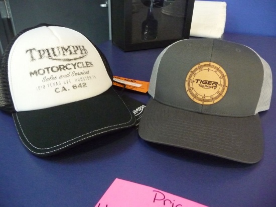 (2) TRIUMPH HATS, (1) BLACK/WHITE AND (1) GRAY