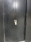 BLACK METAL TWO DOOR CABINET WITH (4) ADJUSTABLE SHELVES