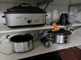 NESCO, CROCK POTS AND BLENDER ON THESE TWO SHELVES