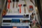 TOOLS ON WALL-MOUNTED PEGBOARD, SAWS, MALLETS,