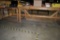 (2) WOODEN WORKBENCHES WITH EXTRA PIECES OF LAMINATE,