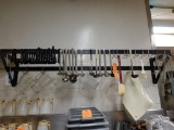 WALL-MOUNT RACK WITH TONGS, PITCHERS, LADLES, WHISK, ETC.