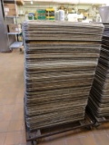 APPROX. 100 ALUMINUM BAKERY TRAYS ON ROLLER BASE