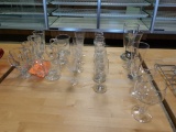 ASSORTED GLASSWARE ON THIS TABLE, MUGS, ETCHED AND MISC.