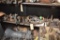 ONE SHELF OF LARGE GEARS, HOLDERS AND HYDRAULIC CYLINDERS