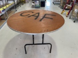 ROUND FOLDING TABLE WITH PLYWOOD TOP RINGED IN
