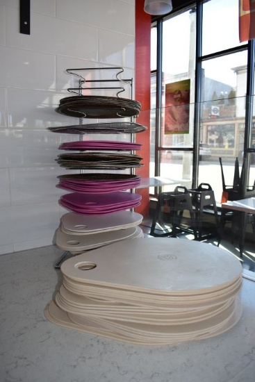 PAN RACK WITH PIZZA PANS AND SCREENS AND STACK OF