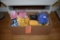 BOX OF BOWS; PINK, YELLOW, BLUE, AND SHREDDED BASKET