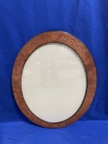 BROWN OVAL FRAME, APPROX. 33