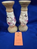 (2) CLAY FLORAL CANDLE HOLDERS
