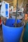 BLUE PLASTIC BARREL WITH AXES, PICK AXES,