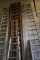 ROW OF WOODEN LADDERS, VARIOUS STYLES AND HEIGHTS
