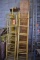 YELLOW ROOF LADDERS WITH EXTENSIONS AND WOOD PLANKS