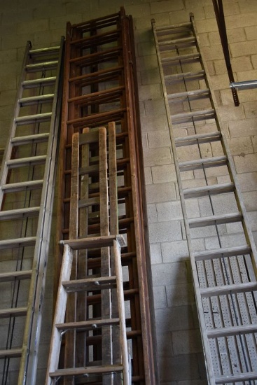 ROW OF WOODEN LADDERS, VARIOUS STYLES AND HEIGHTS