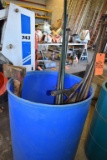 BLUE PLASTIC BARREL WITH AXES, PICK AXES,