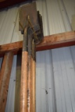 LONG HANDLED SHINGLE SCRAPERS ON HOOKS AND ON FLOOR BENEATH