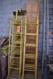 YELLOW ROOF LADDERS WITH EXTENSIONS AND WOOD PLANKS
