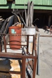 METAL CAGE, TWO DRUMS, WOODEN CRATE WITH