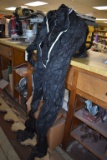 BOX OF BLACK DISPOSABLE COVERALLS