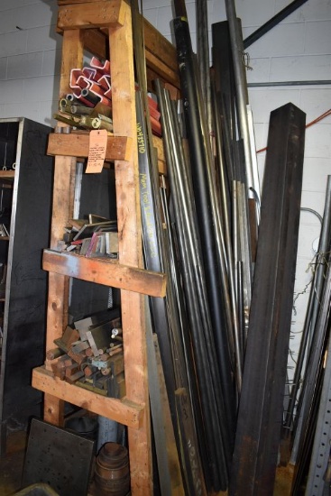 HOMEMADE WOODEN ANGLED STOCK SHELF WITH CONTENTS ON