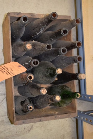VINTAGE EMPTY GREEN AND BROWN WINE BOTTLES IN CRATE