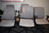 (6) GRAY MATERIAL OFFICE CHAIRS ON CASTERS
