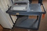 GRAY METAL CART ON CASTERS AND BROTHER TYPEWRITER,