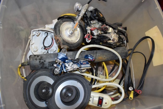 SURGE STRIPS, SPEAKERS AND TOY MOTORCYCLES IN BIN