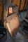 ASSORTED LUMBER ON BACK WALL STACKED VERTICAL WITH