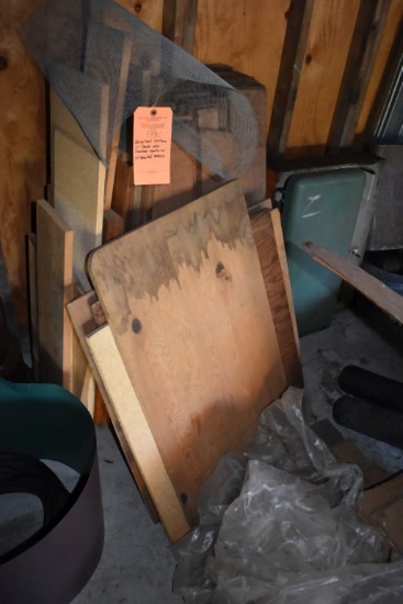 ASSORTED LUMBER ON BACK WALL STACKED VERTICAL WITH