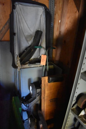 CREEPER, MOWER PARTS AND SHELVING PIECES IN CORNER